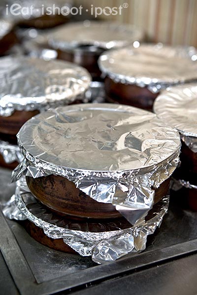 Individual servings of Biryani in pots to keep warm