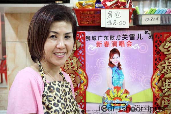 Doris next to poster of her charity event