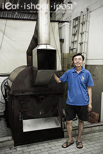 Dominic with a traditional coffee roaster