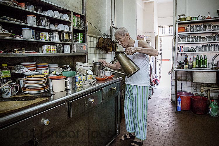 77 year old Mr Shi making kopi