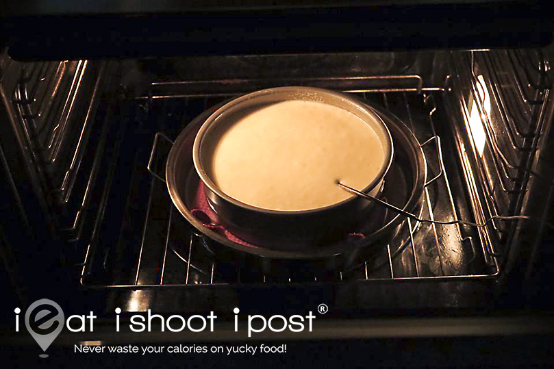 Measuring the internal temperature of the cake as it bakes