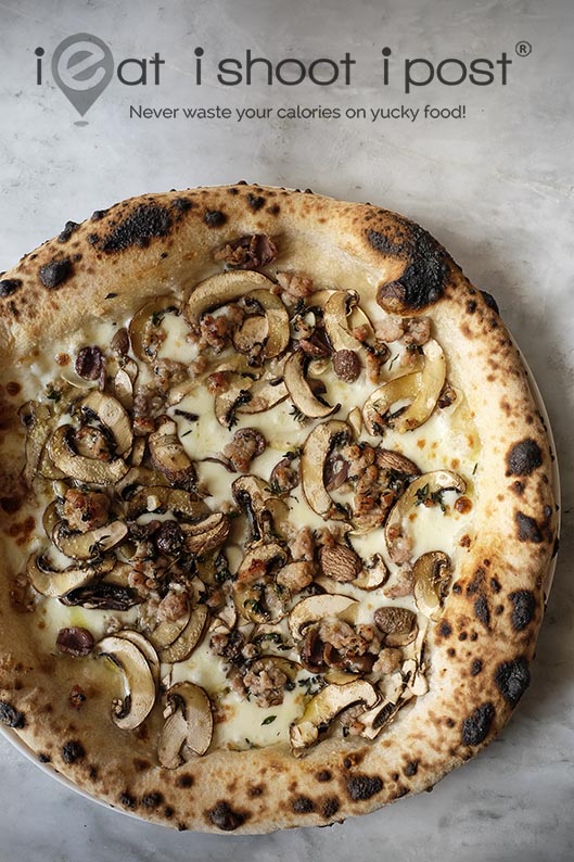 Cremini mushrooms and sausage pizza