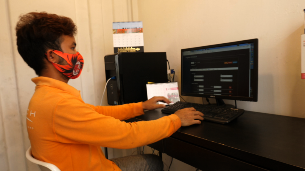 Urban farmer monitoring the farm conditions on his computer